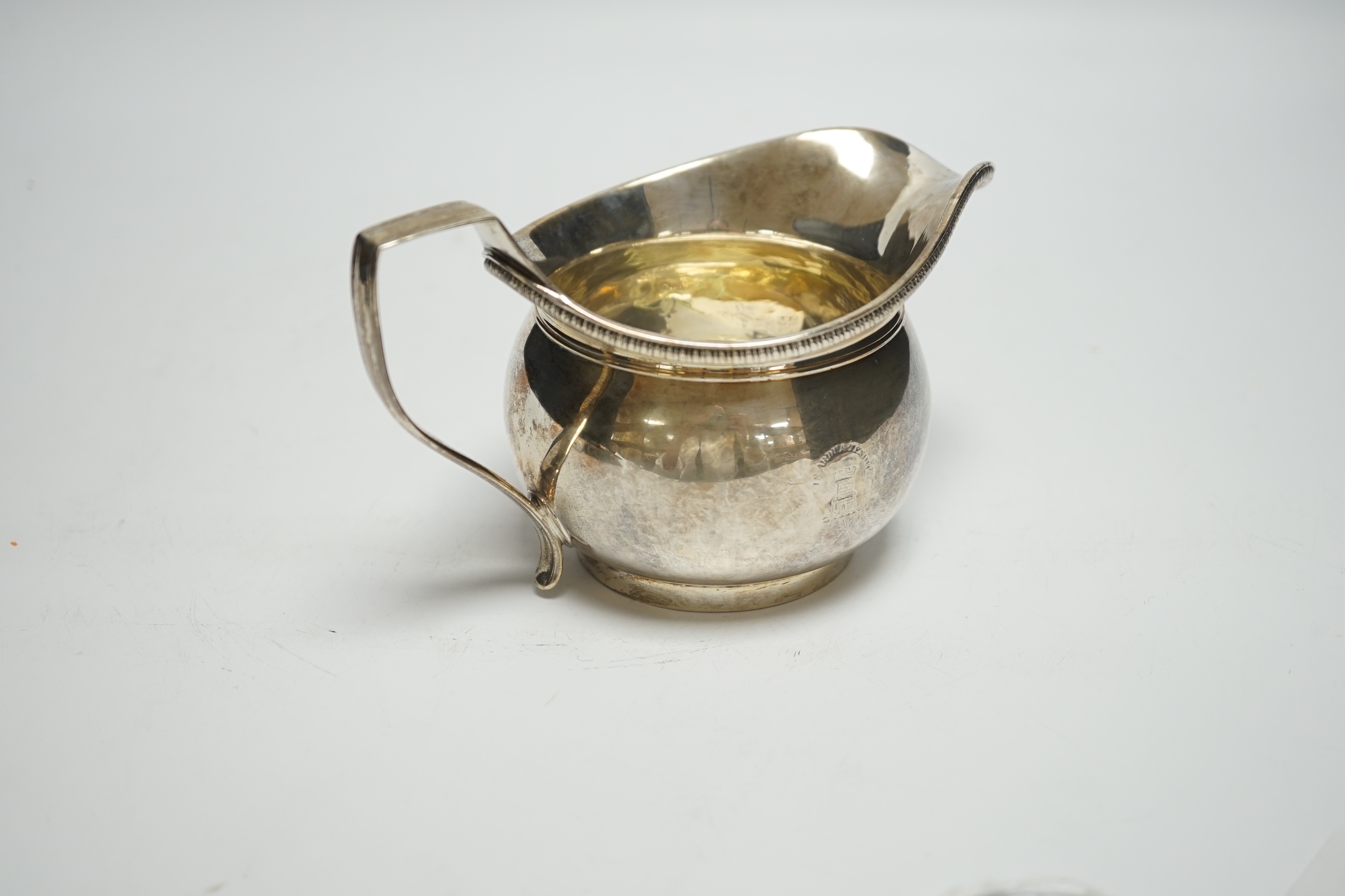 A George III silver cream jug, Richard Cook, London, 1802, 6.3oz.